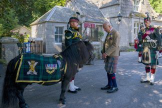 King Charles meets Shetland pony at Balmoral military ceremony as he begins summer residency in Scotland