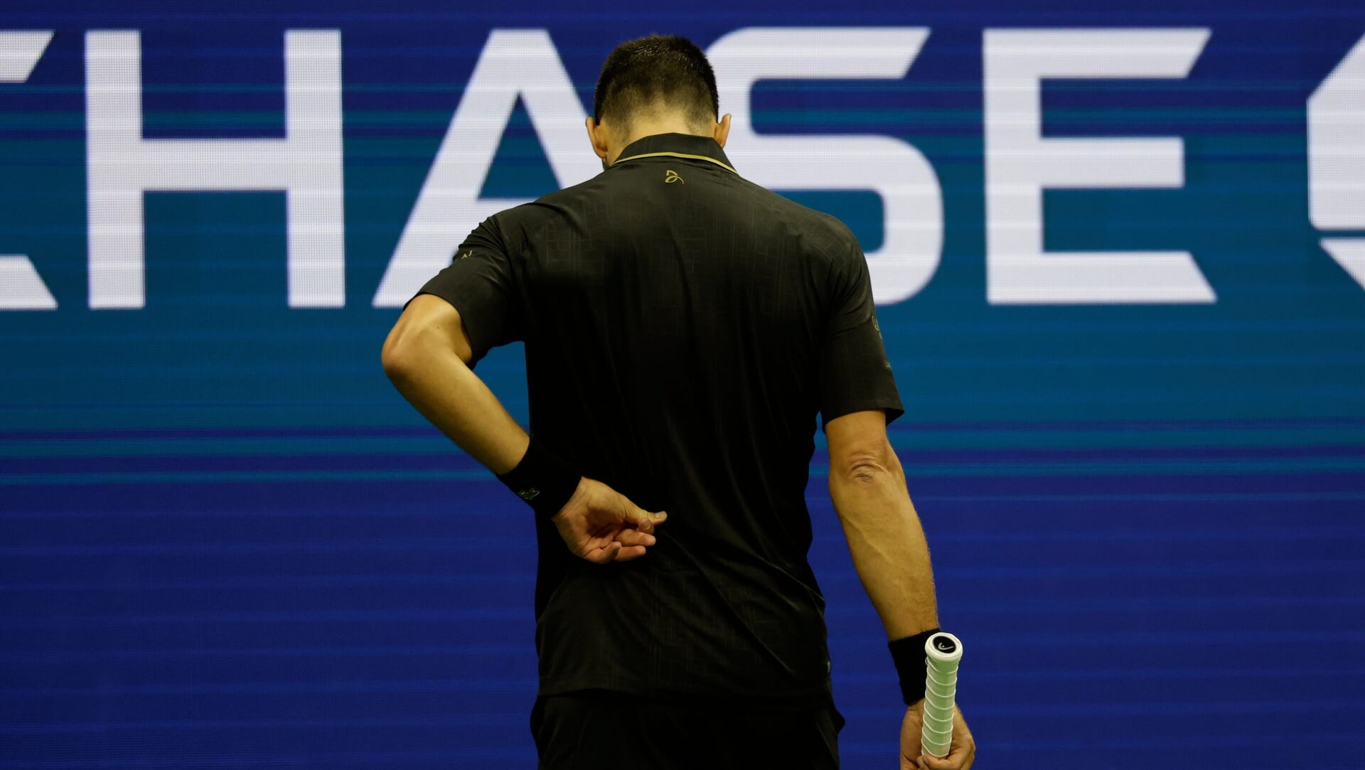 Novak Djokovic held his back.