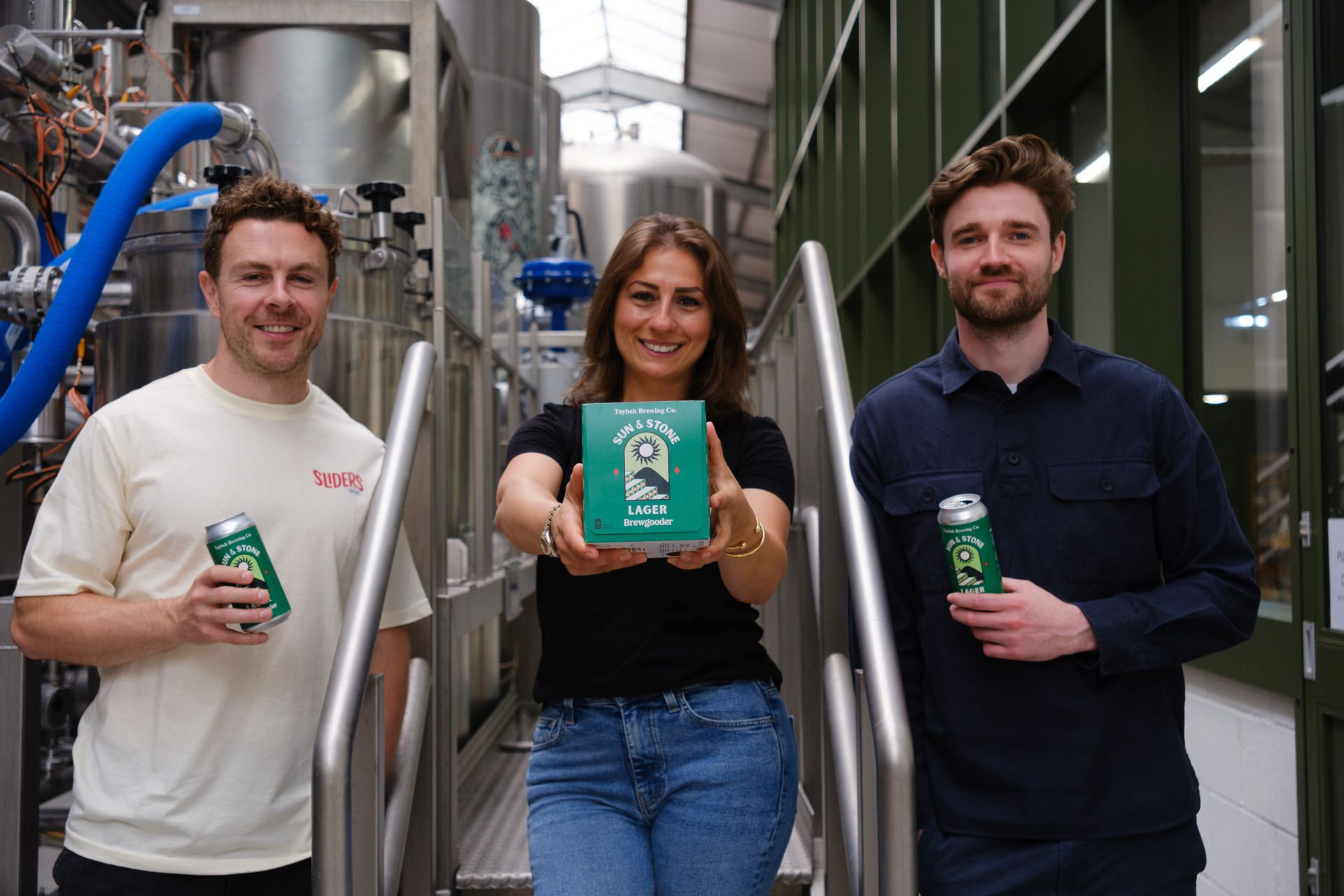 Madees Khoury, centre, with Brewgooder co-founders Alan Mahon, left,  and James Hughes