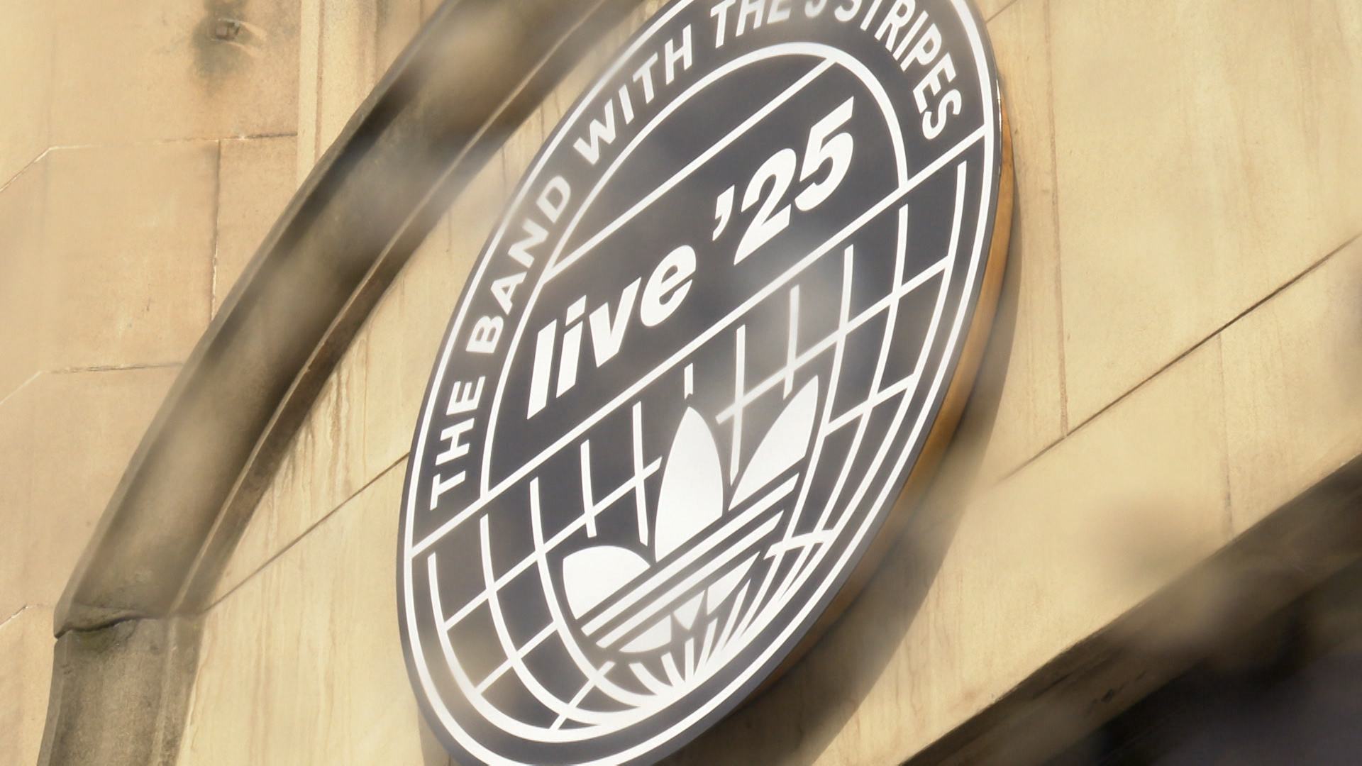 Fans began lining up hours before the official Oasis Live '25 Fan Store opened on George Street.