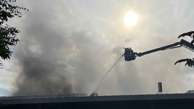 Two high-reach appliances were battling the blaze at its height.
