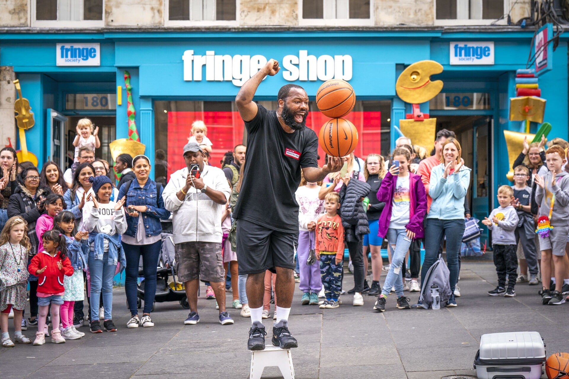 Circus street artist ‘BasketballMan’ performs for the crowds on the Royal Mile, Edinburgh, ahead of this year’s Edinburgh Festival Fringe.