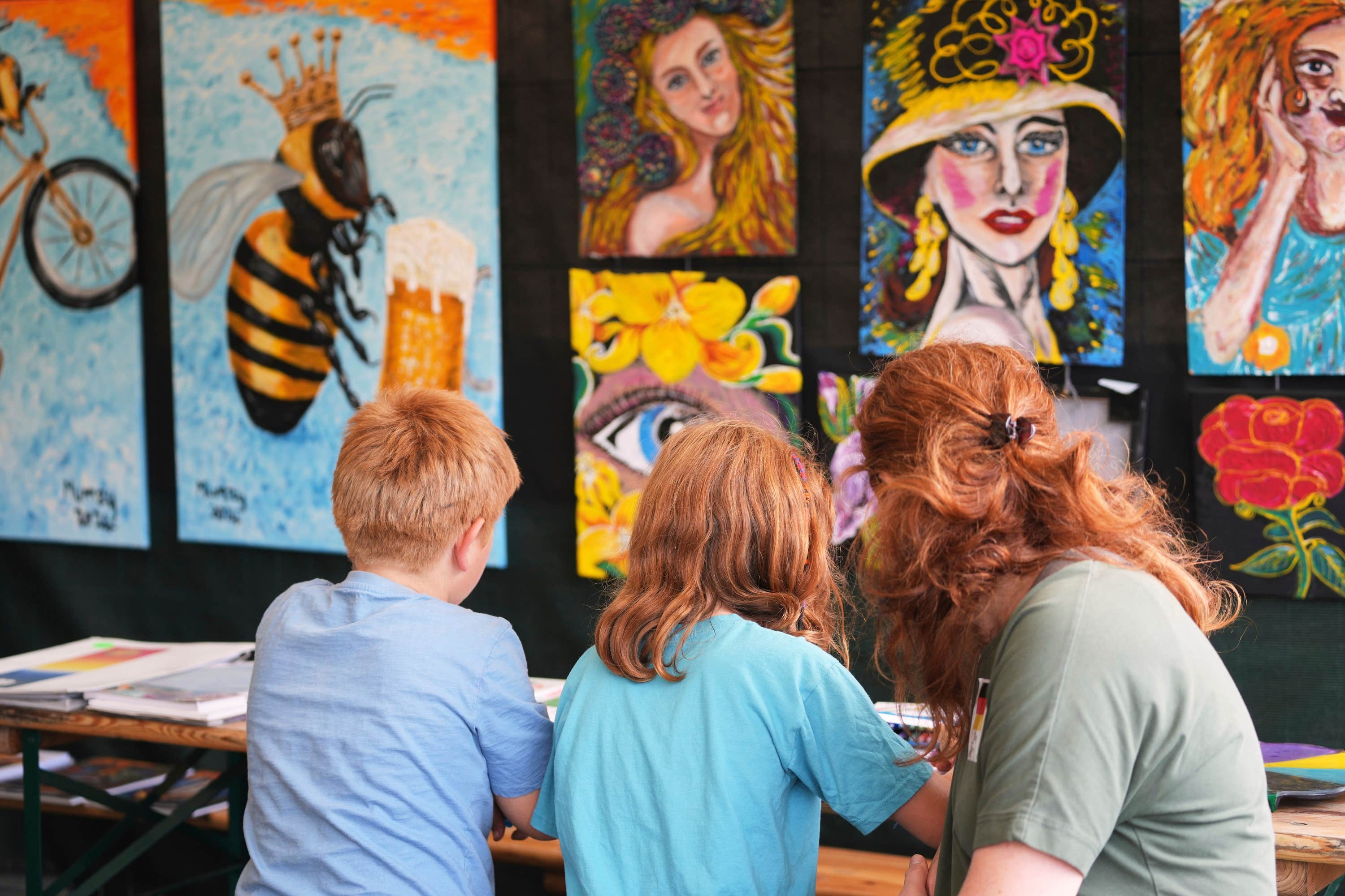 A family take part in a painting workshop.