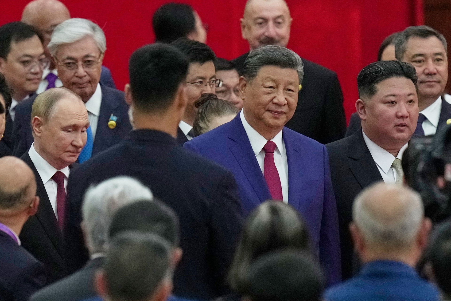 Chinese President Xi Jinping, centre, with North Korean leader Kim Jong Un, right, and Russian President Vladimir Putin.