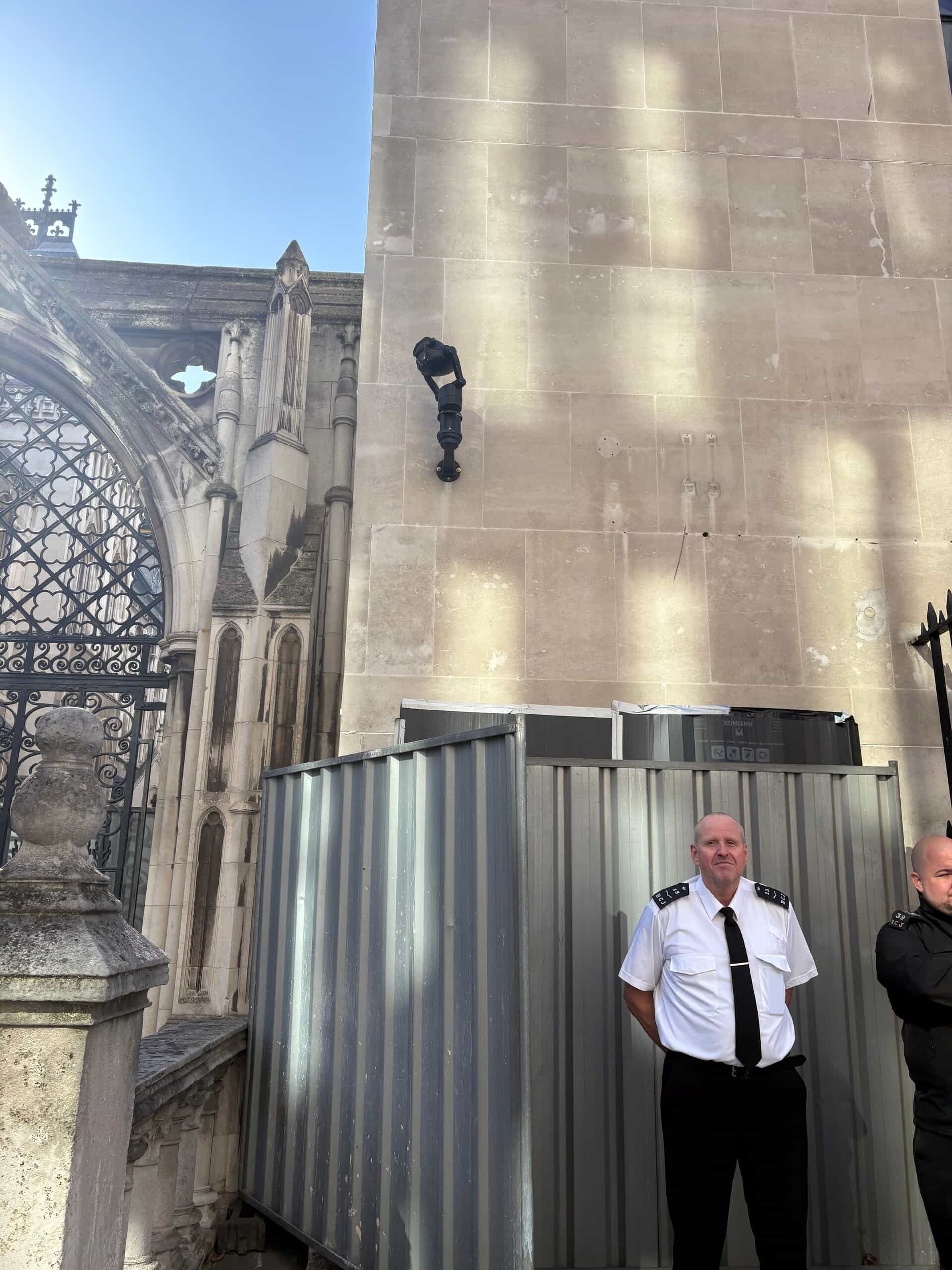 The new artwork being guarded by security officials