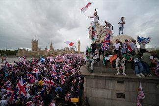 Thousands gather in London for Tommy Robinson rally and counter-protest