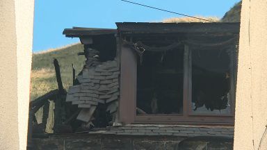 Road closed for ten days after Gardenstown home engulfed by flames as woman still missing