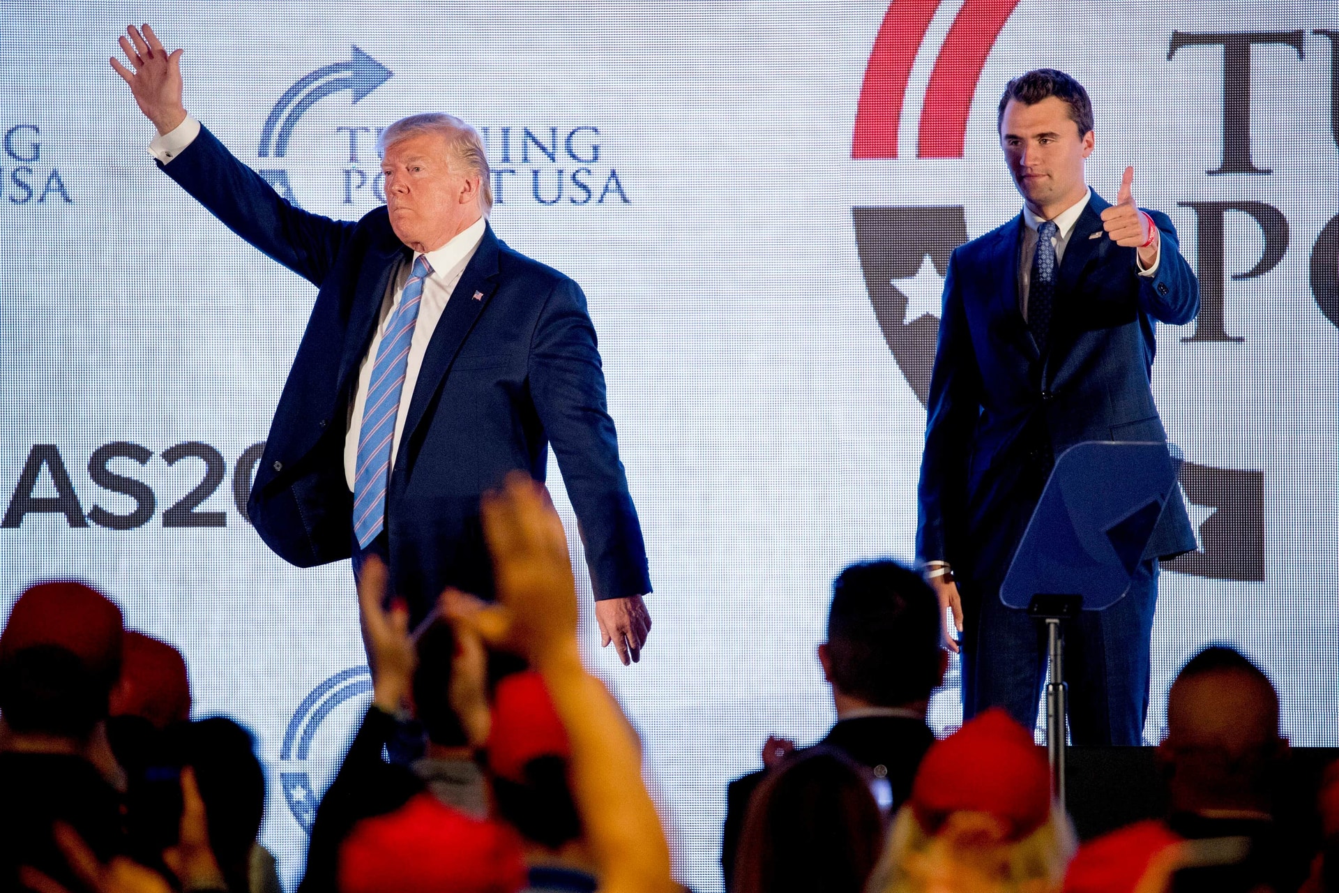 President Donald Trump is joined on stage with Turning Point USA Founder Charlie Kirk in 2019 (Andrew Harnik/AP).