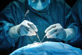 NHS surgeon admits fraud after having his own legs removed