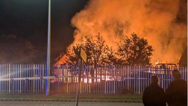 Fire rips through new-build houses as firefighters tackle blaze overnight