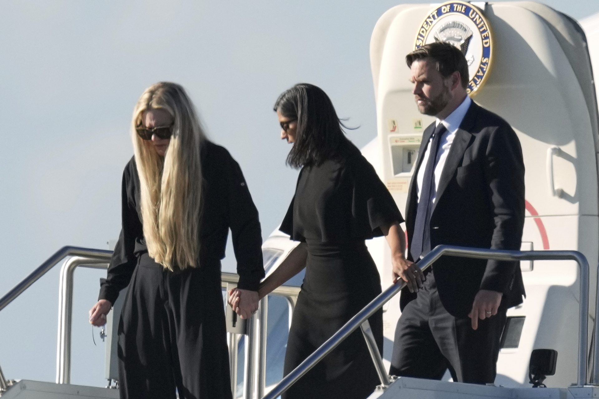 (L-R) Erika Kirk, Usha Vance and vice president JD Vance deplane Air Force Two, carrying the body of Charlie Kirk, in Phoenix on Thursday (Ross D Franklin/AP).