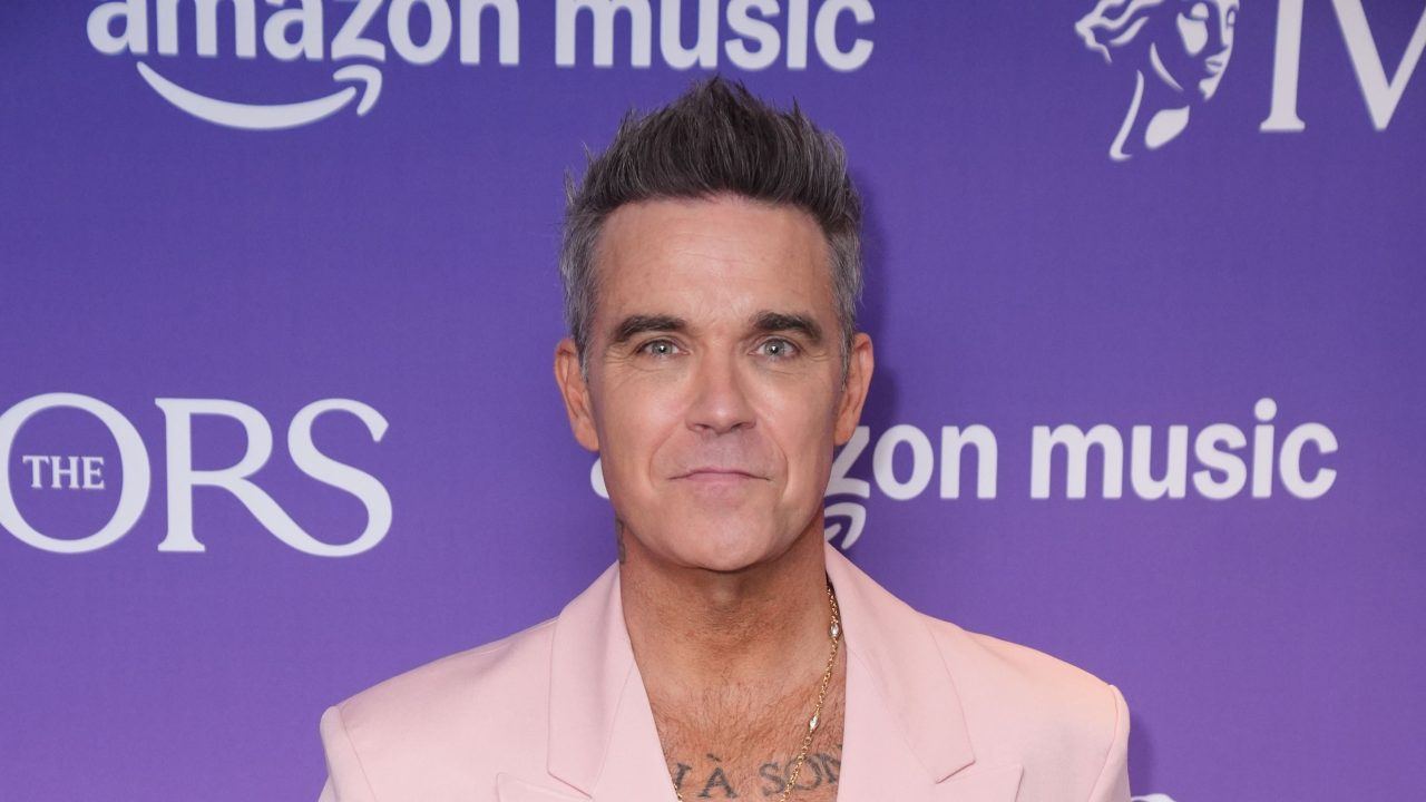 Robbie Williams is hoping to notch up his 16th number one album accolade.