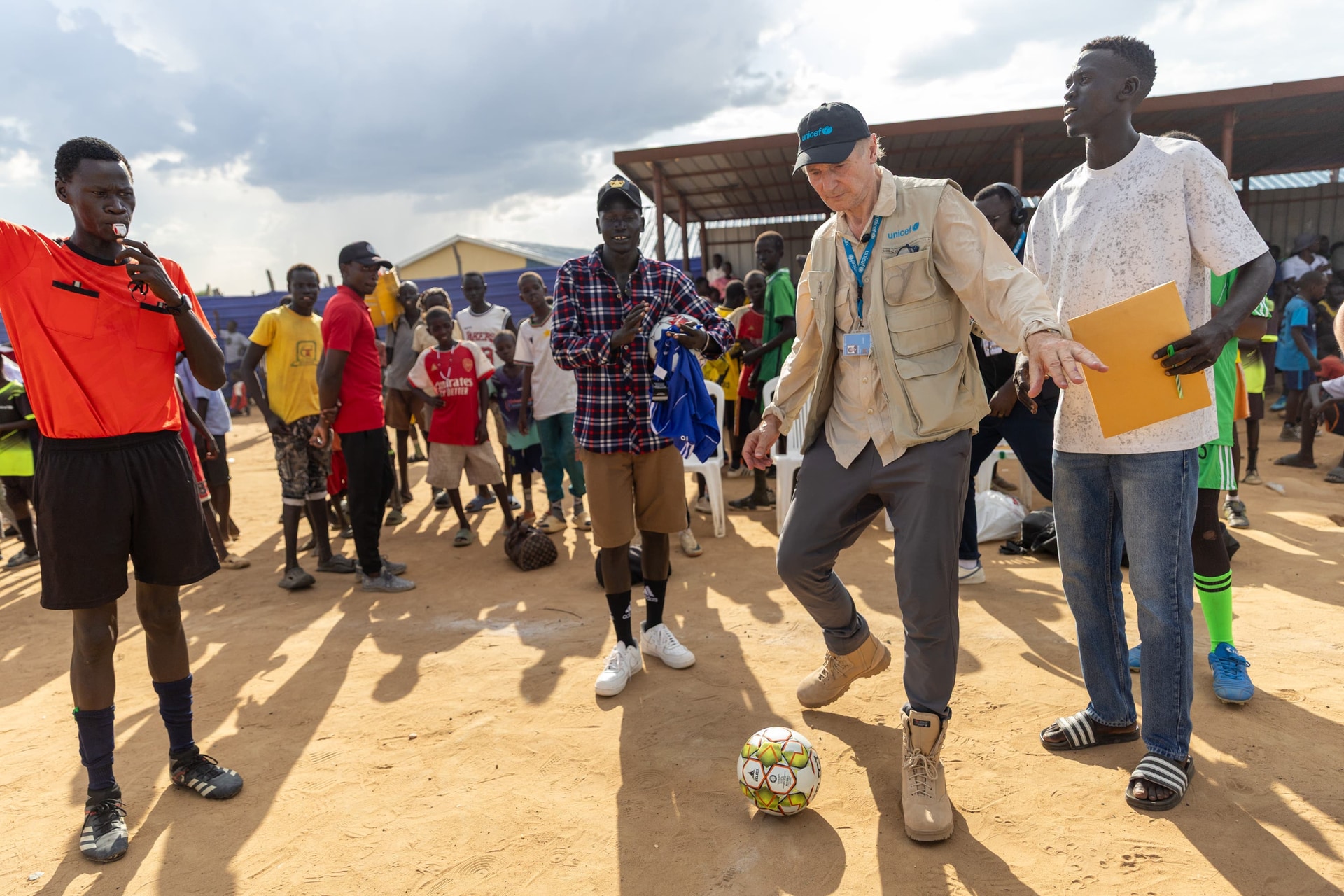 Alaak Kuku (centre) established a foundation to empower young people through sport (Unicef/PA).
