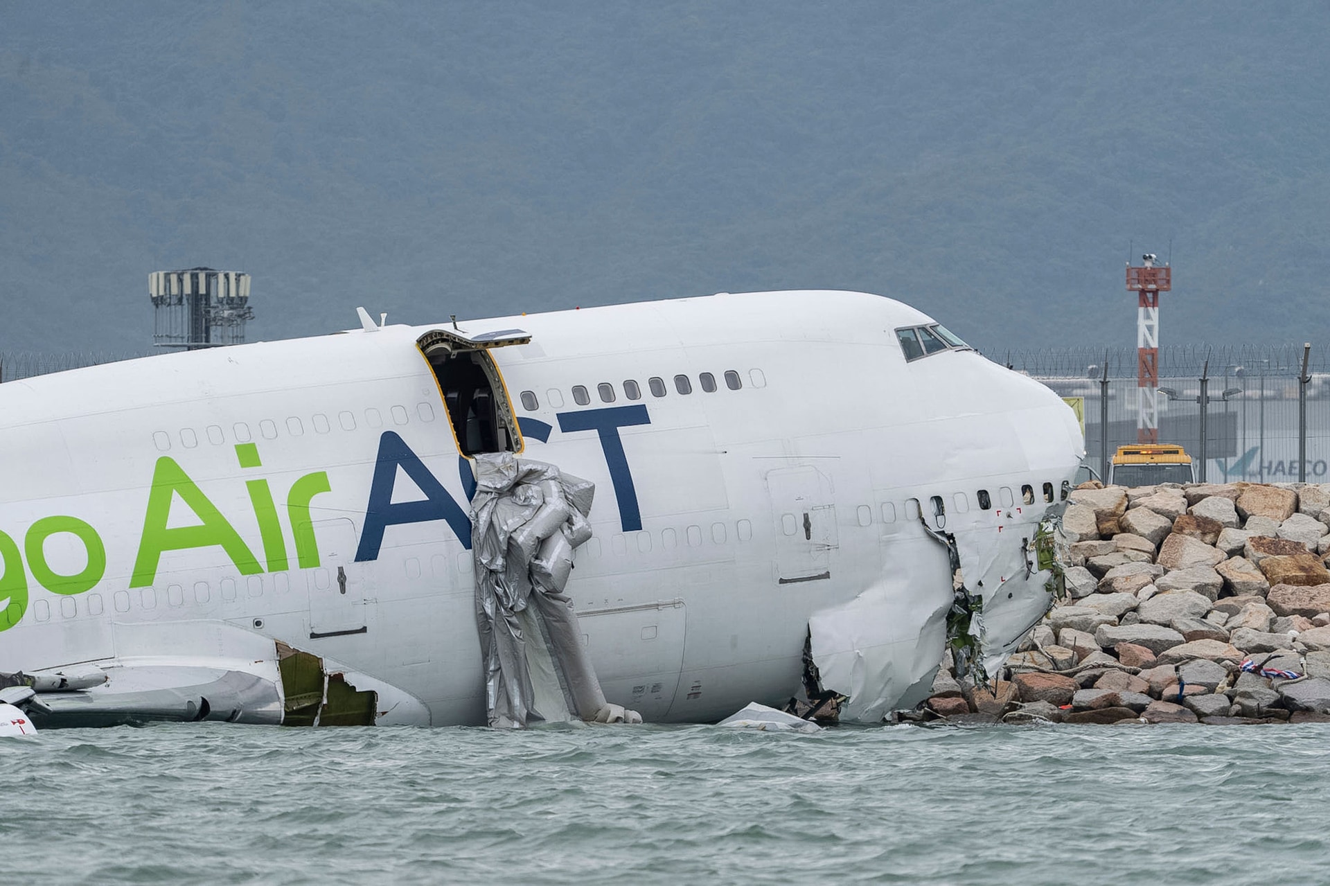 The plane skidded off a Hong Kong runway
