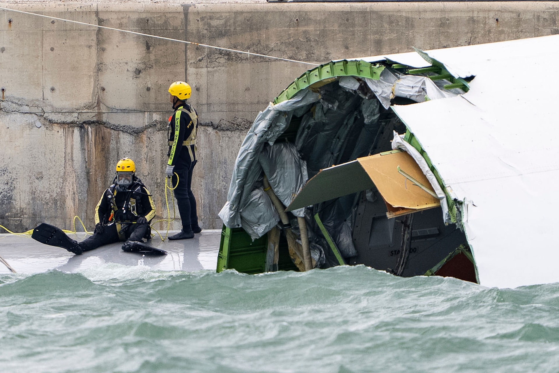 The plane skidded off a Hong Kong runway