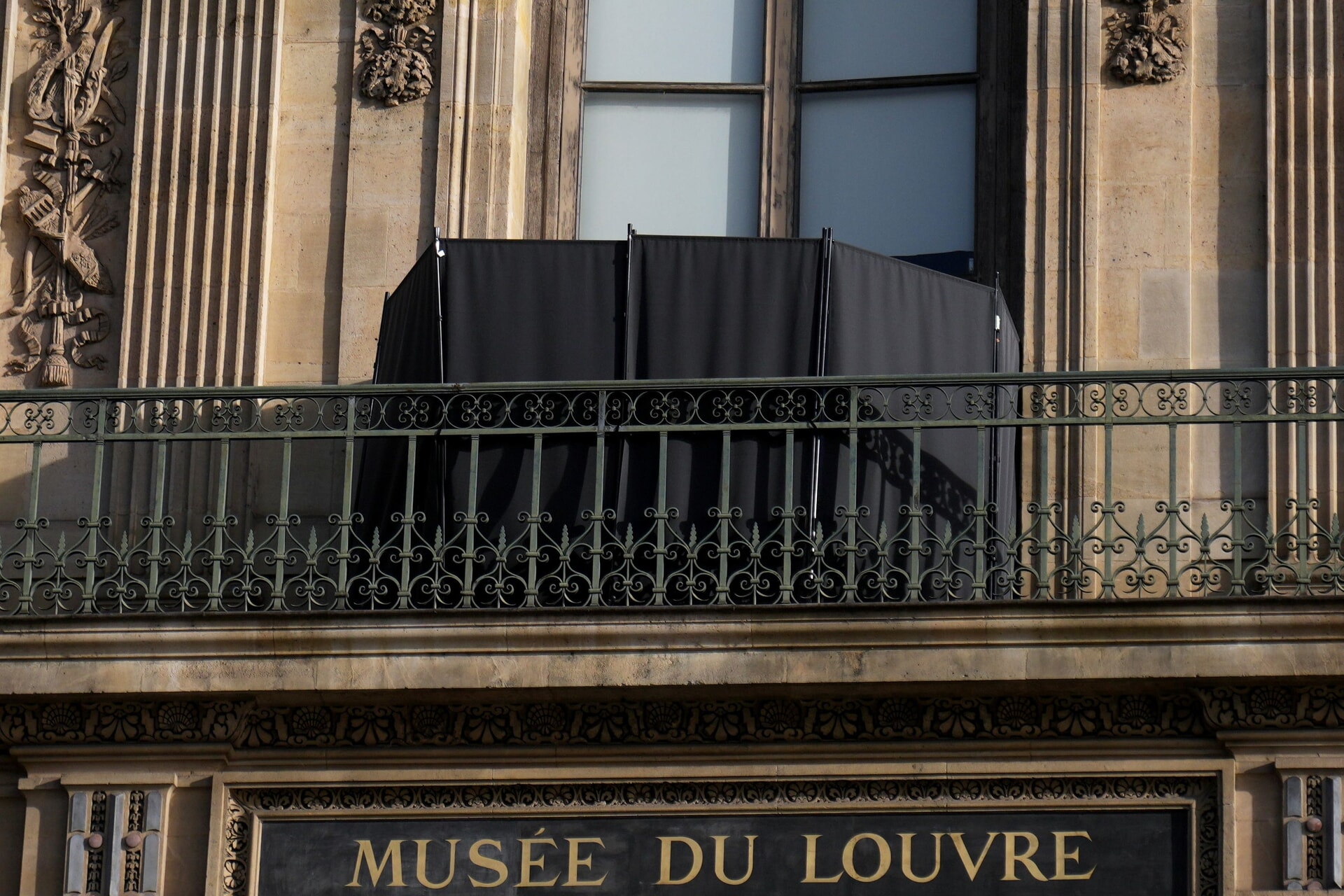 A black curtain covers the window where thieves entered the site.