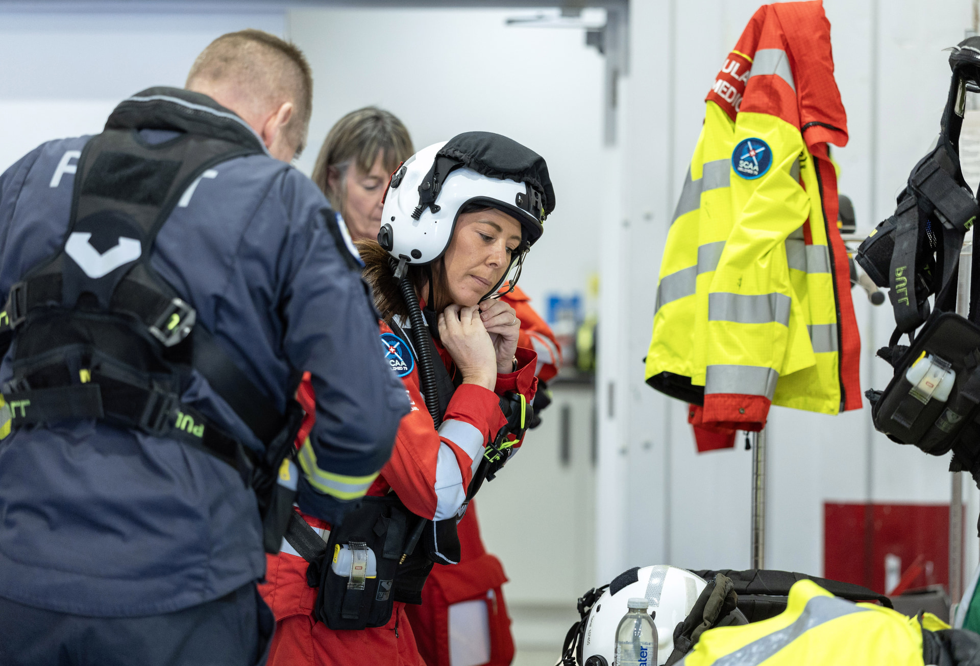 Paramedic Laura Paterson puts on her lifejacket and helmet before leaving the Aberdeen base for a medical emergency in North East Scotland.
