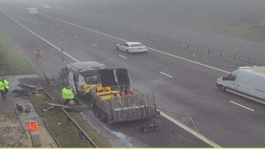 M8 disruption after van bursts into flames as drivers face long rush hour delays