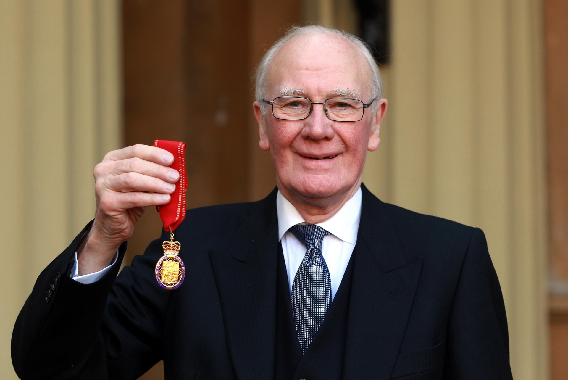 Sir Menzies Campbell holds his medal after being made a Companion of Honour by the Duke of Cambridge during an investiture ceremony at Buckingham Palace, central London.