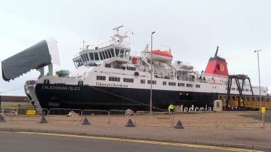 Passenger rescued after falling overboard from CalMac ferry before bomb threat made