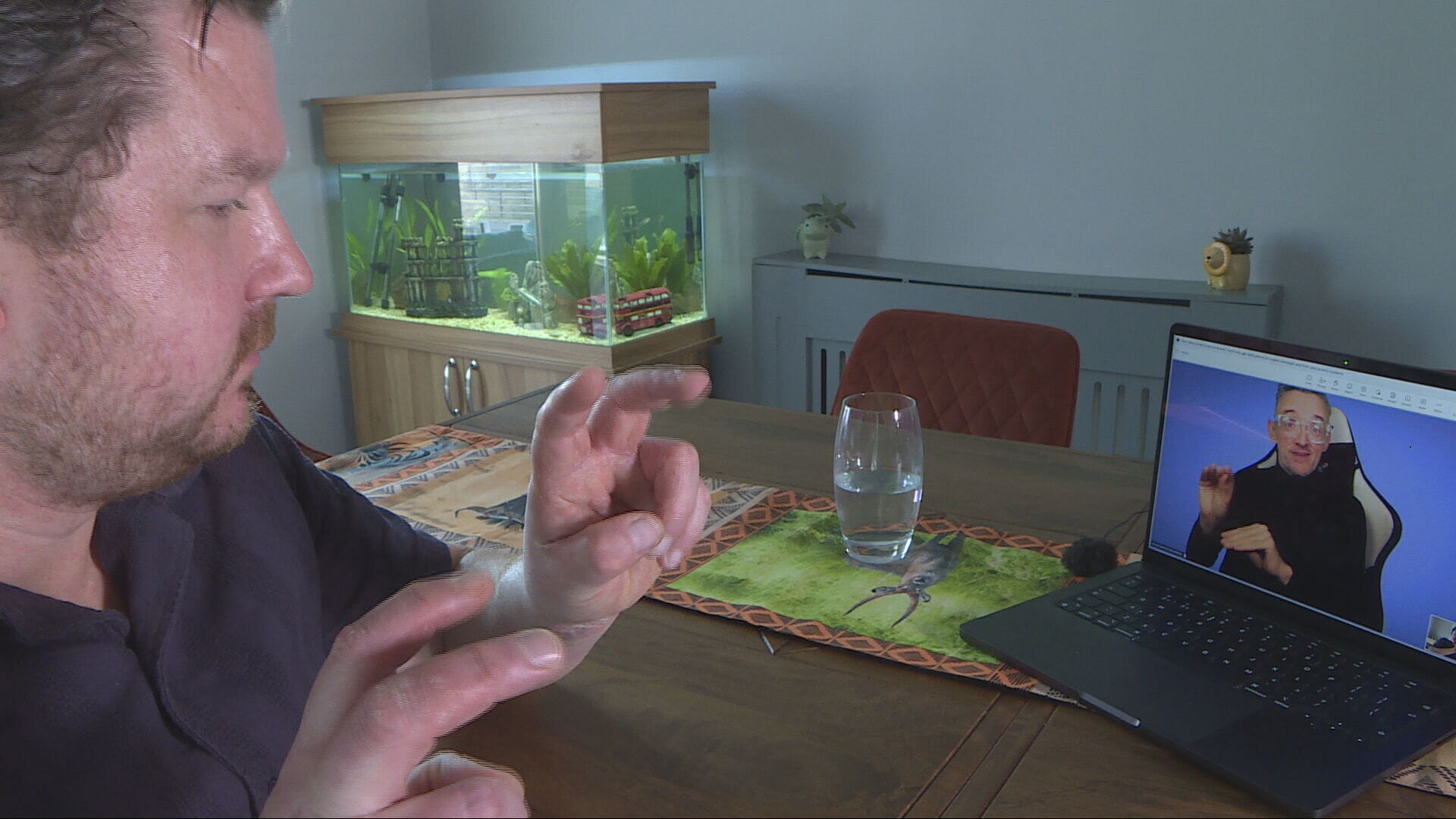 Richard using an interpreter over video call.