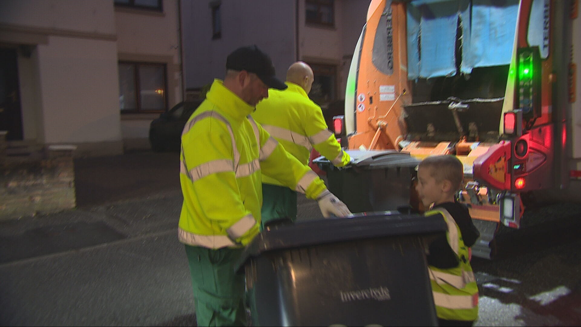 Jaxx with his local binmen in Greenock