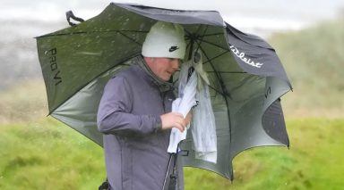 Robert MacIntyre battles brutal conditions to take share of lead at St Andrews