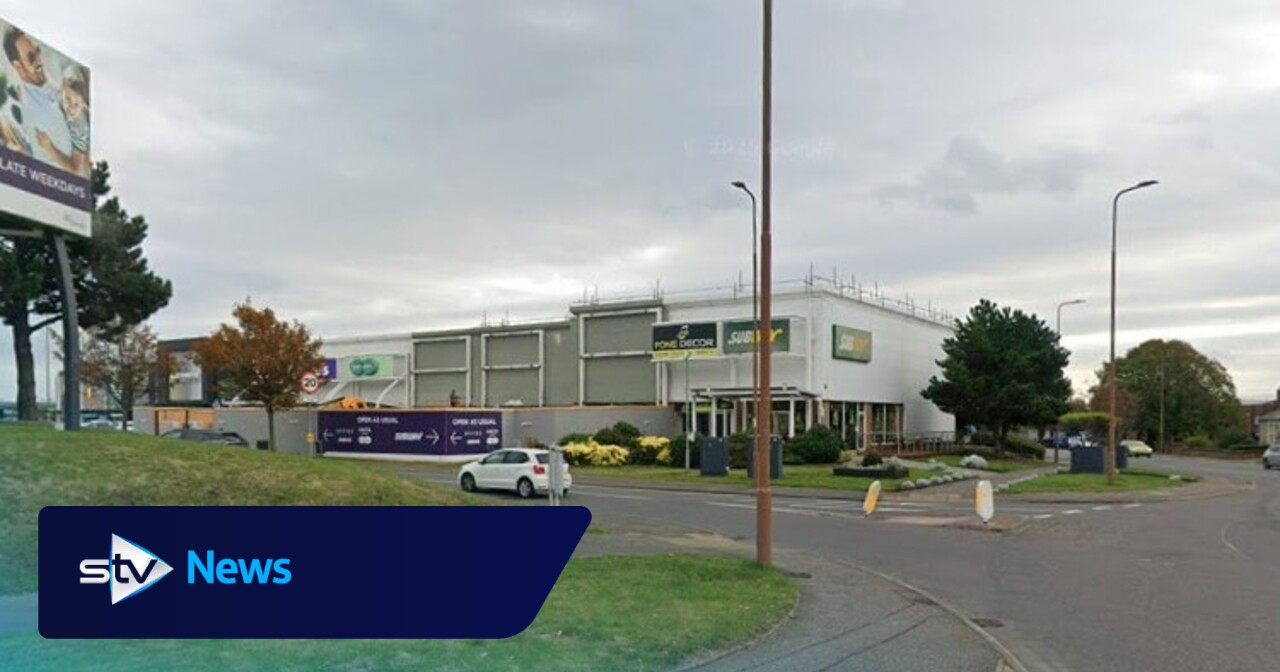 Man, 22, taken to hospital after being 'stabbed' near retail park