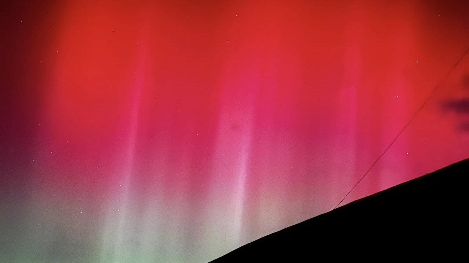 The lights are caused by the solar particles interacting with the atmosphere.