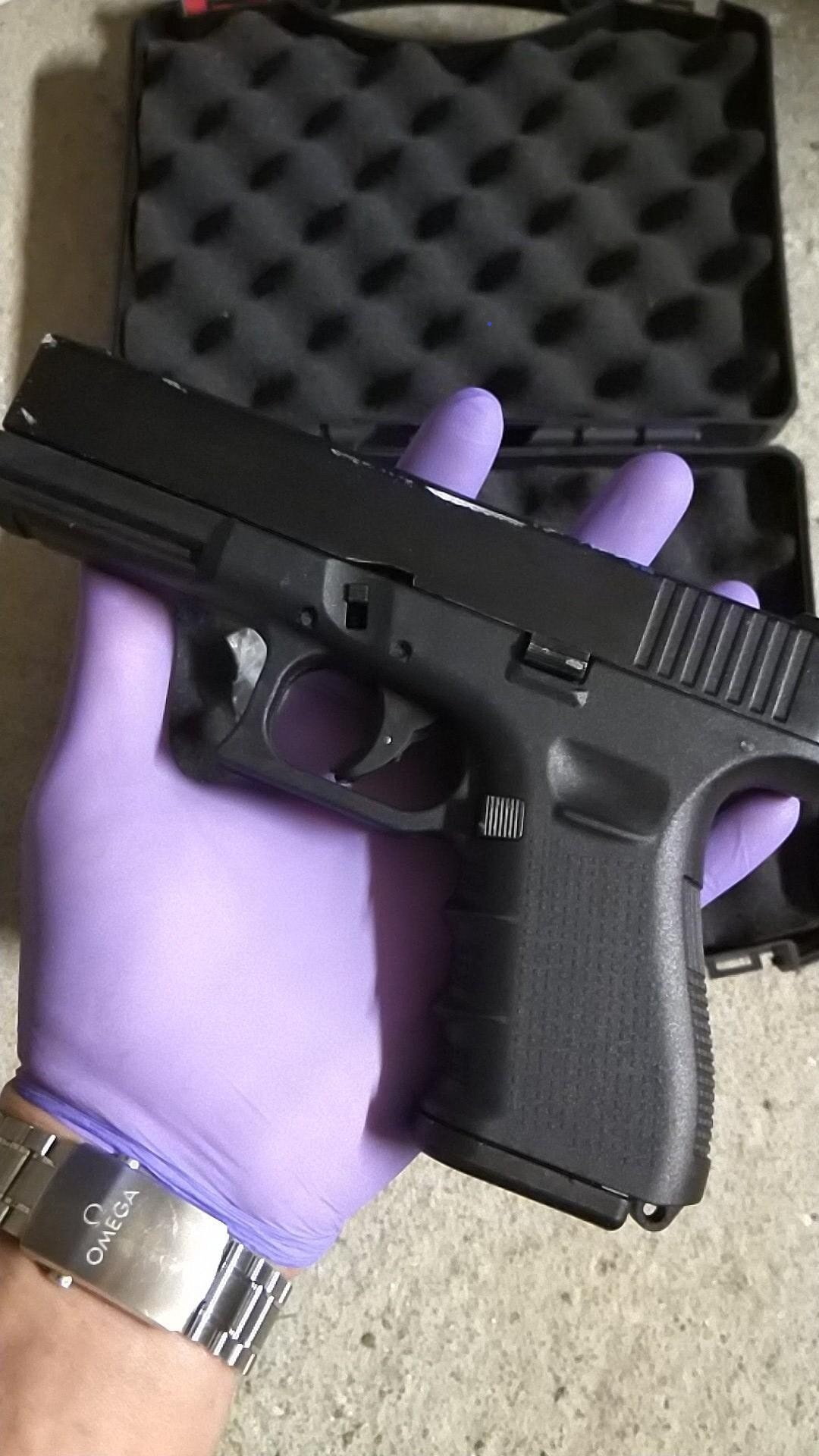 A criminal associate sent Kinnaird an image of a gloved hand holding a self-loading pistol.