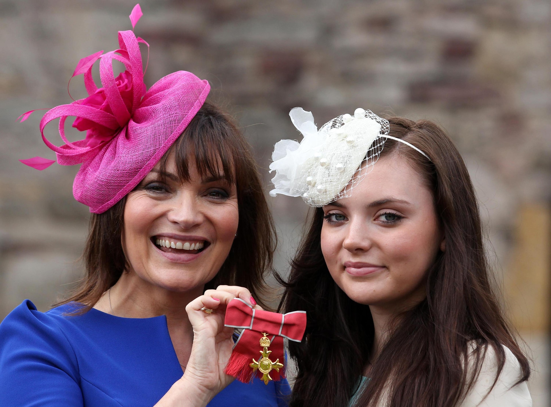 Lorraine Kelly with her daughter Rosie after she was awarded an OBE by the Queen for services to charity and the armed forces (PA).
