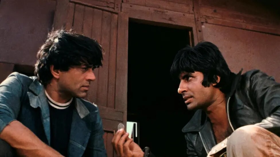 Dharmendra (left) in Sholay with Amitabh Bachchan (right).