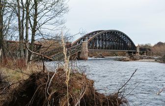 Historic rail bridge collapses into River Spey