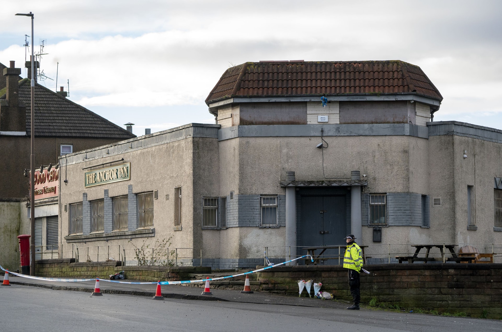 Floral tributes left close to the scene near the Anchor Inn in Granton, Edinburgh (Jane Barlow/PA)
