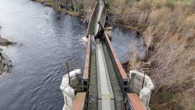 Historic rail bridge collapses into River Spey