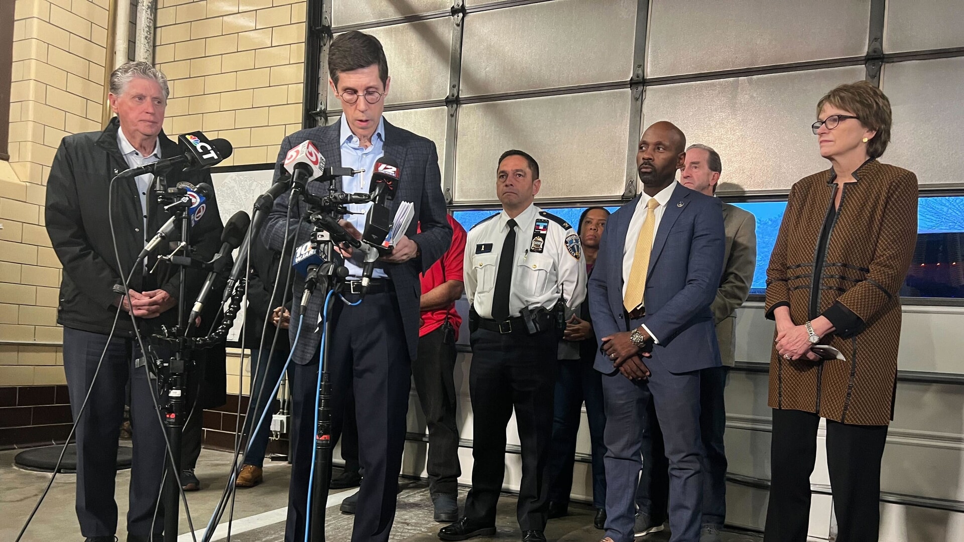 Mayor Brett Smiley speaks to reporters during a news conference in Providence.