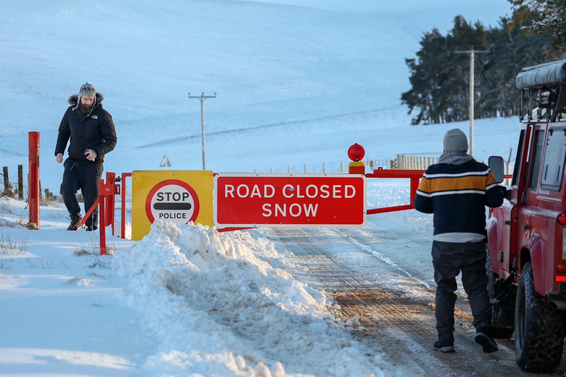 Members of the public are seen at the snow gates at the A939 Cockbridge.