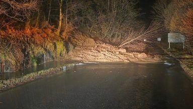 Road closed overnight after landslide as flood warnings remain in place
