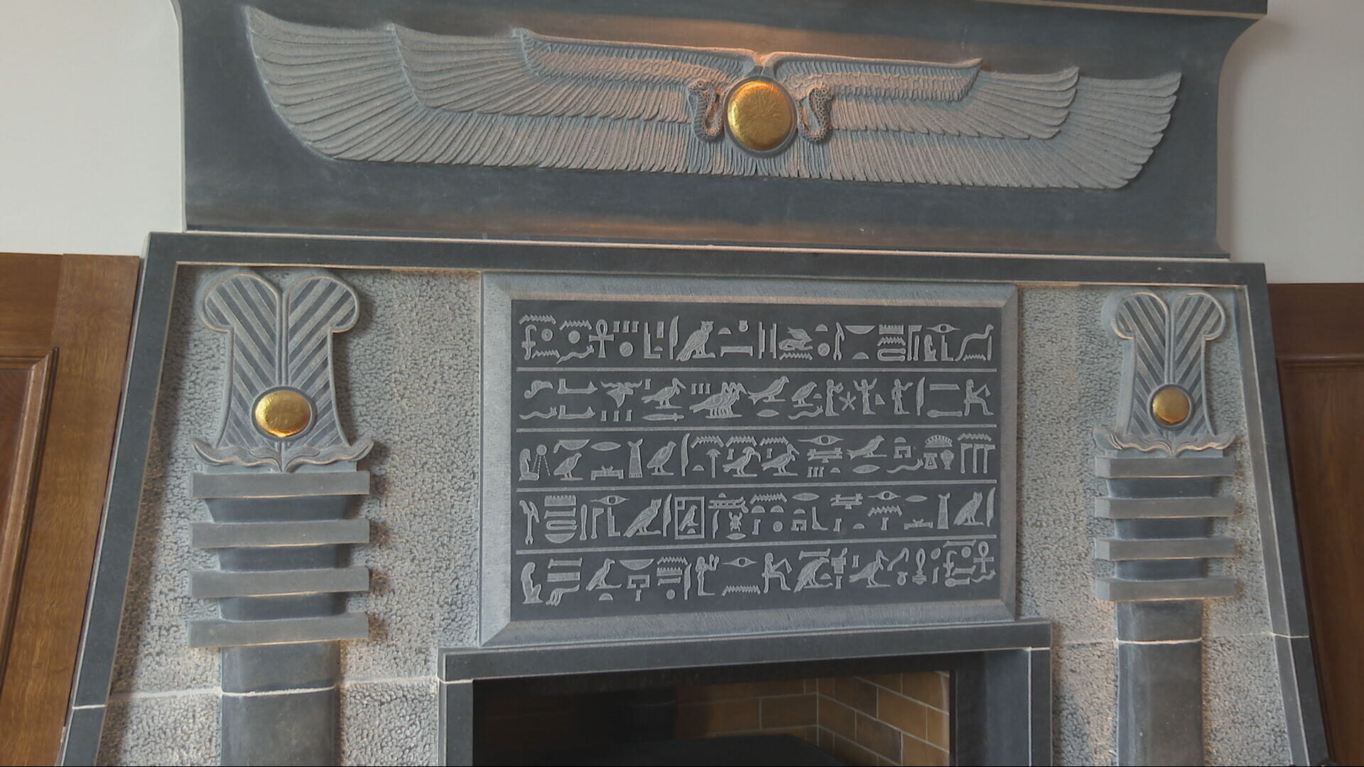 Egyptian hieroglyphics engraved on fireplace