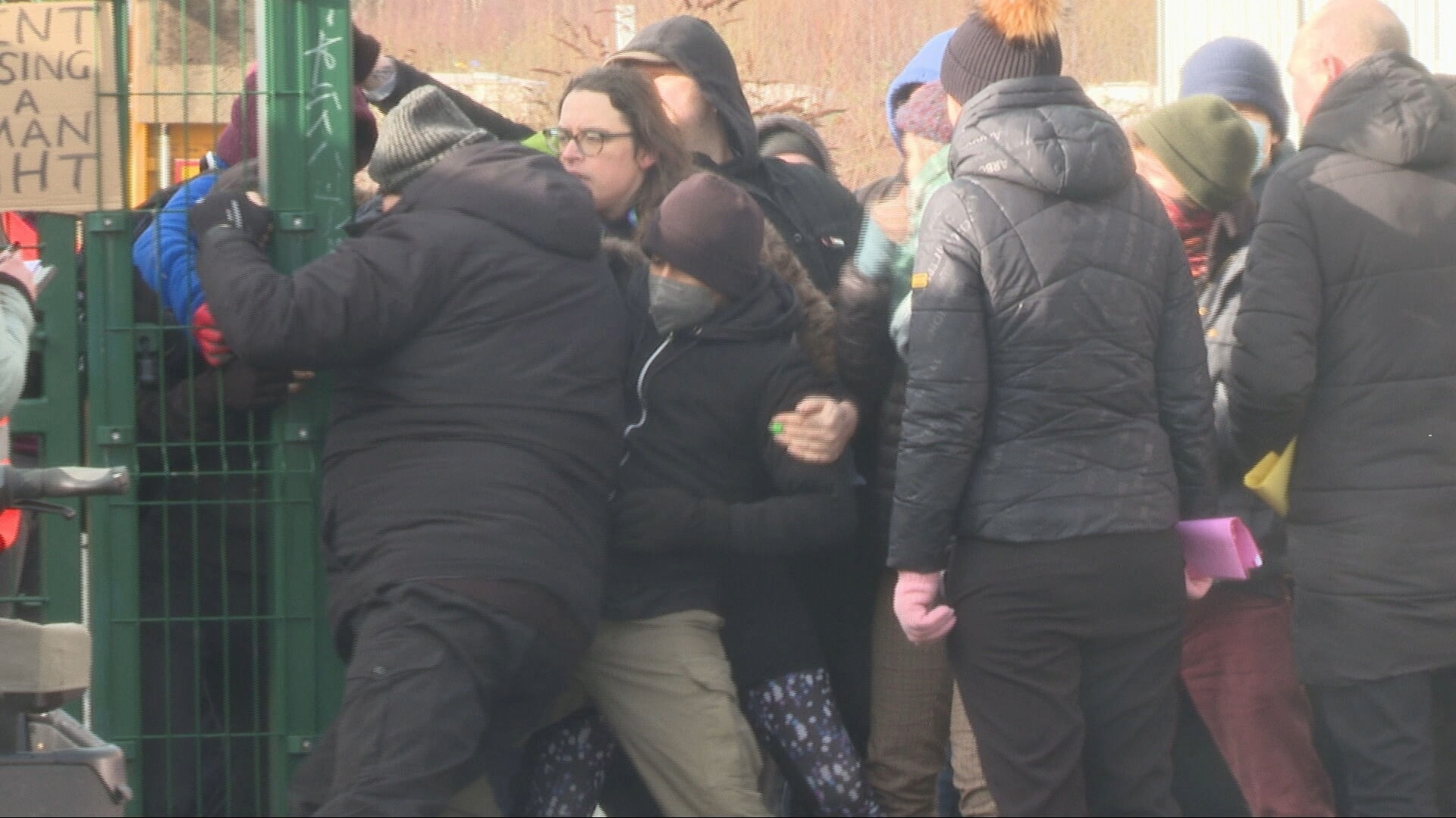 Protestors formed a human chain to block enforcement agents from entering the area.