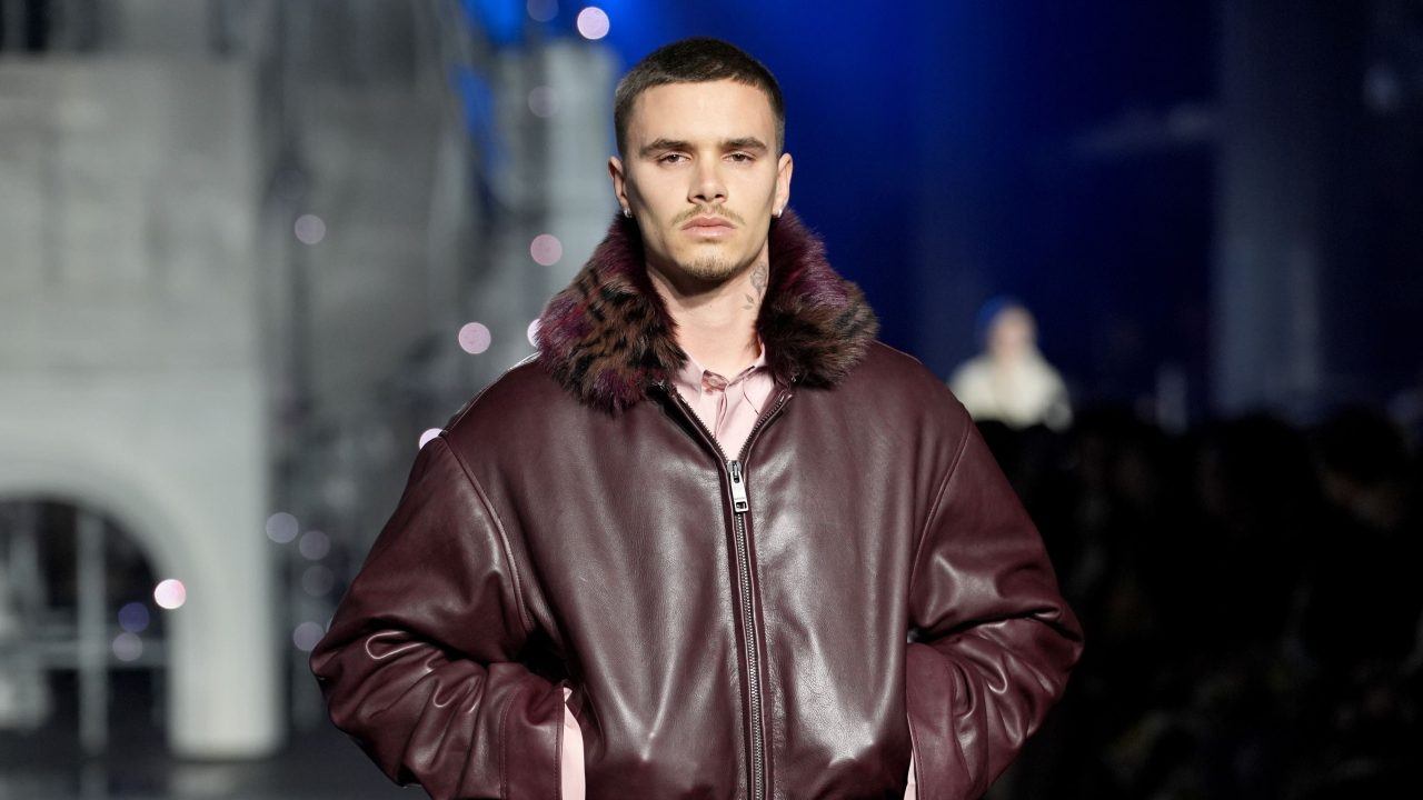 Romeo Beckham and Rosie Huntington-Whiteley on catwalk at London Fashion Week