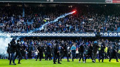 Arrests made as fans clash on Ibrox pitch after Celtic knock Rangers out of cup
