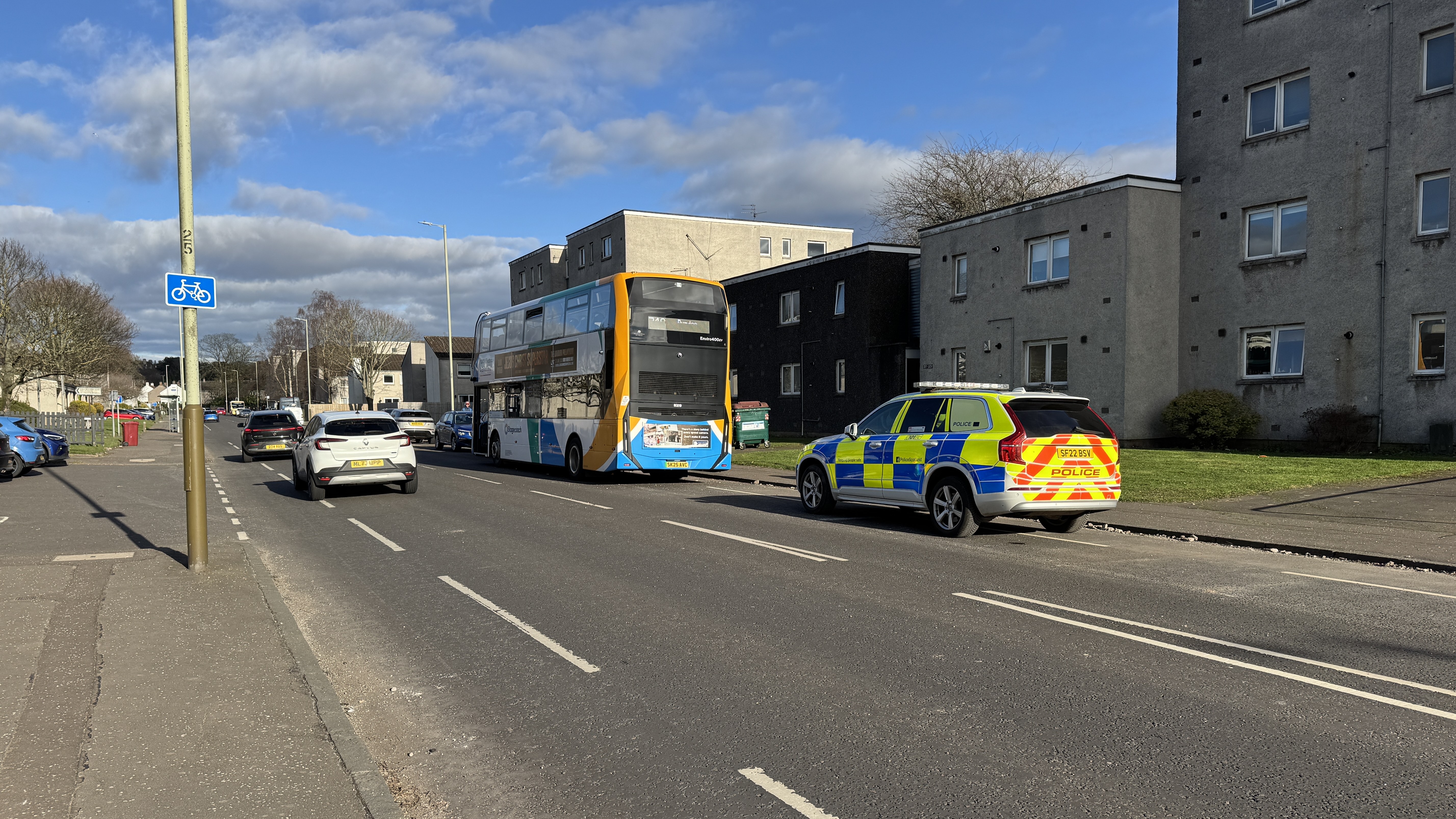 Images from the scene appear to show the island of a pedestrian crossing damaged with debris strewn down the street.