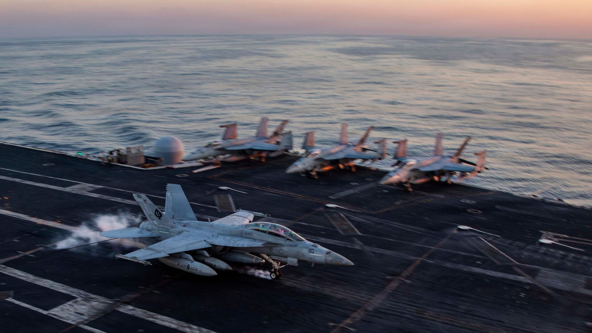 An F/A-18F Super Hornet prepares to land on the USS Abraham Lincoln in support of Operation Epic Fury