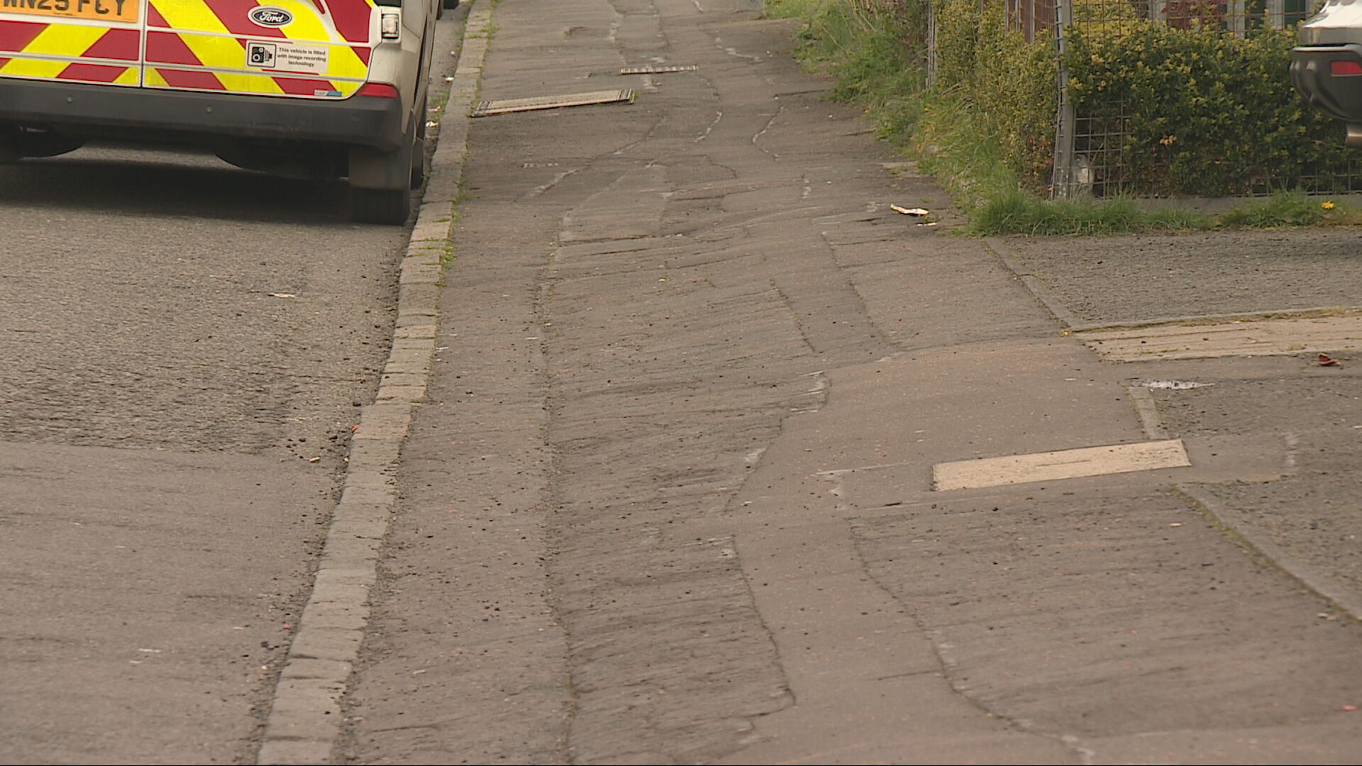 Sloped, cracked pavements in Broomhouse