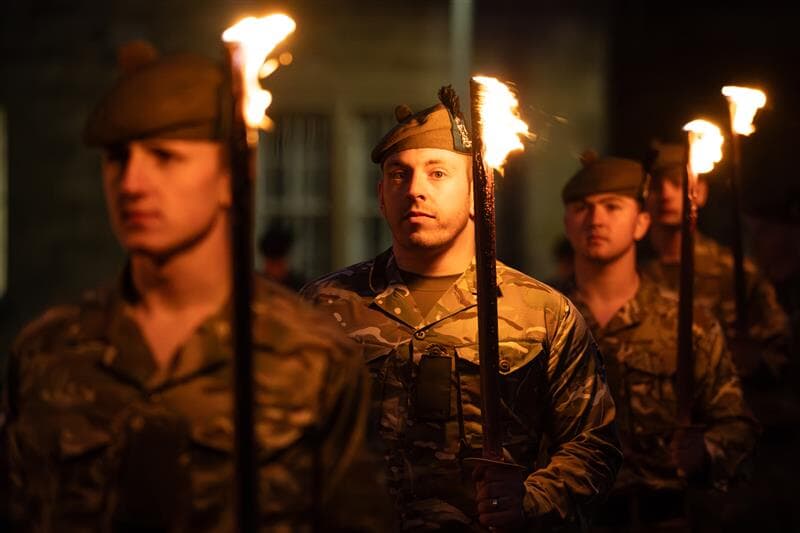 Soldiers illuminating Glencorse Barracks, near Edinburgh, to celebrate the anniversary
