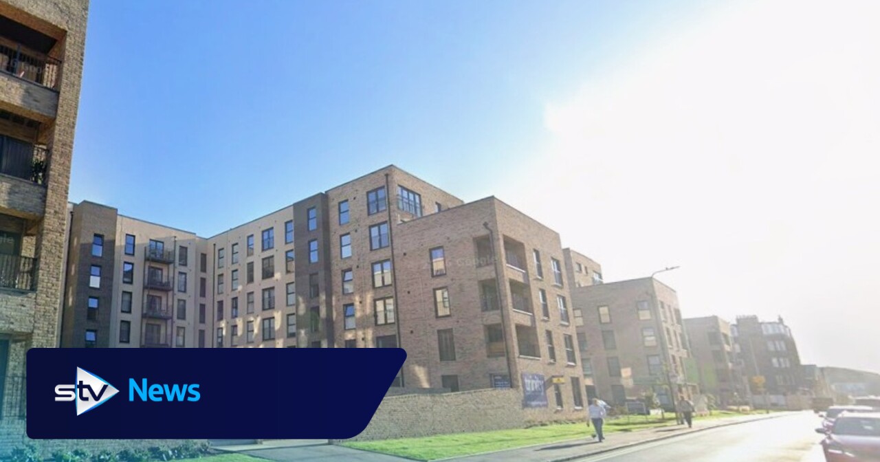 Teenager taken to hospital after falling from Edinburgh flat block ...