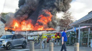 Firefighters tackle ‘well-developed’ blaze at Uddingston car garage overnight