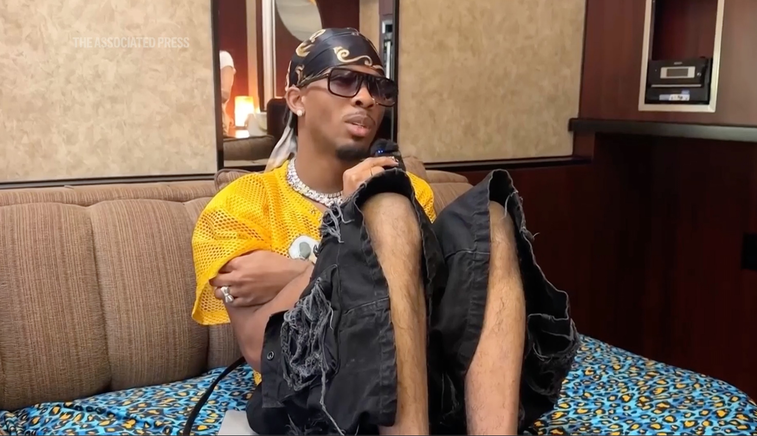 Singer-songwriter, David Burke aka D4vd sits in an artist space at Coachella music festival in 2025