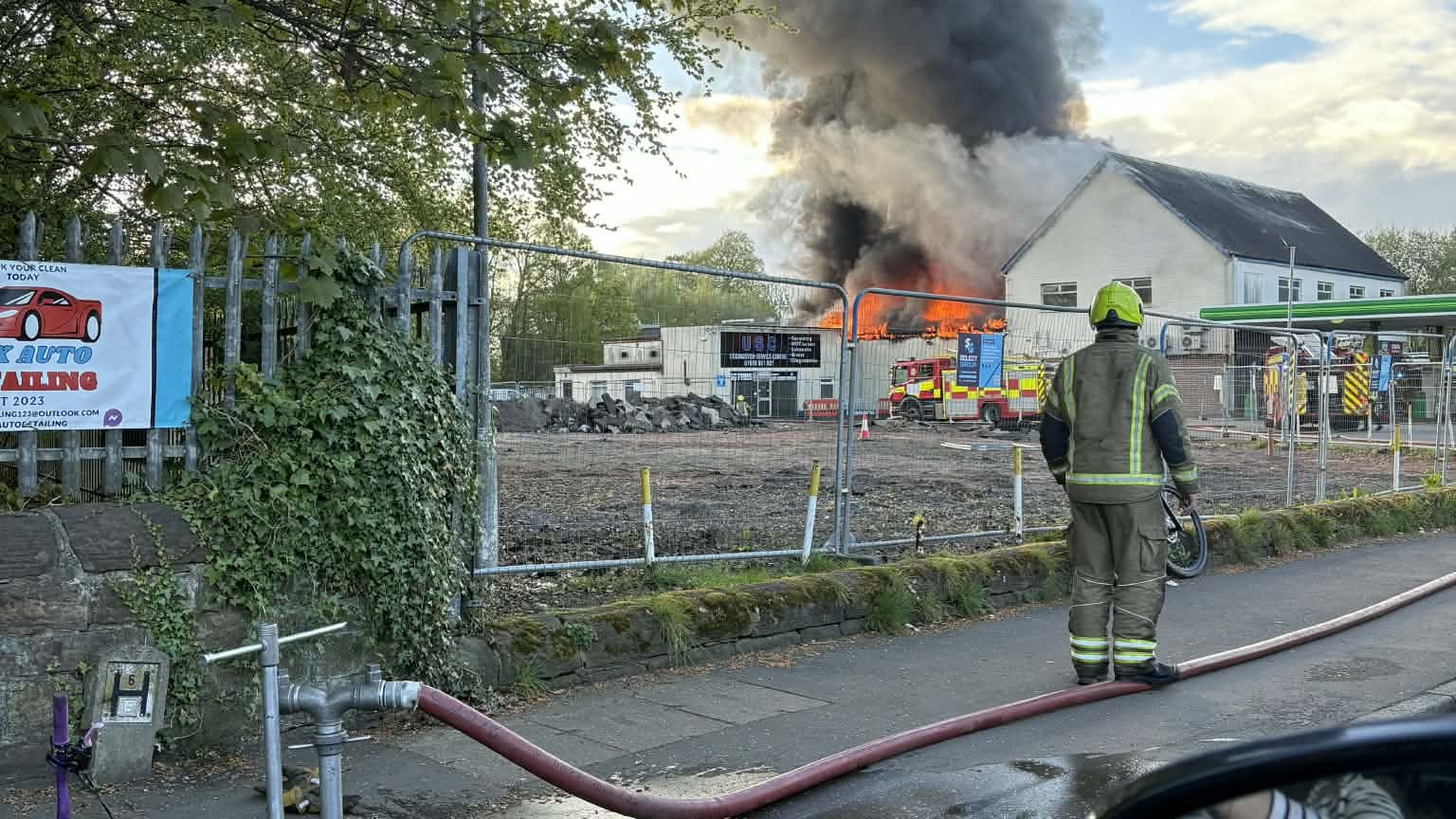 The fire has taken hold of a building near a BP garage and a Tesco